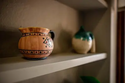 two vases are sitting on a shelf at Cottage, Eco Estate, private and tranquil in Gatehouse