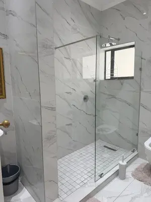 a shower with a glass door in a bathroom at Secret Place in Pretoria