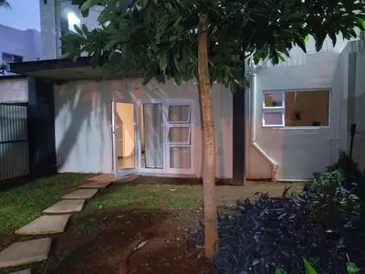a small white house with a tree in the yard at Grace 523 in Pretoria