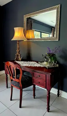 a wooden desk with a lamp and a mirror at Belle Vie Boutique Guesthouse in Pretoria