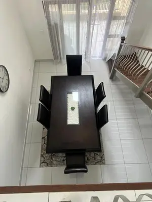 a flat screen tv sitting on top of a room at Home away from Home in Midrand