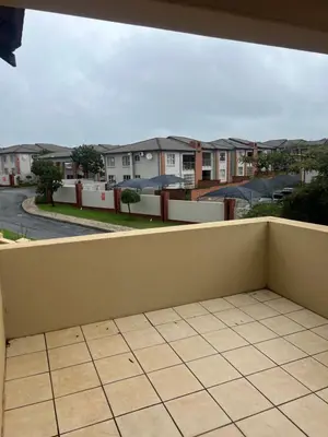 a balcony with a view of a residential neighbourhood at Home away from Home in Midrand