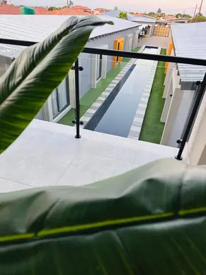 a balcony with a view of a swimming pool at Impèrio Boutique Guest Lodge in Siyabuswa