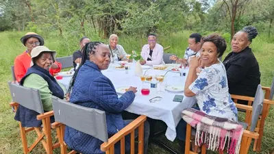 a group of older people sitting around a table at Matsila Game Lodge in Thohoyandou