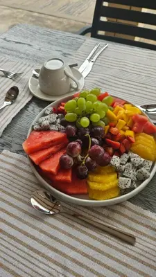 a plate of fruit and vegetables on a table at Matsila Game Lodge in Thohoyandou