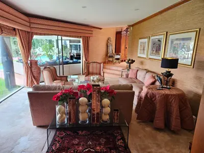 a living room with a couch and a table at The Embassy in Pretoria