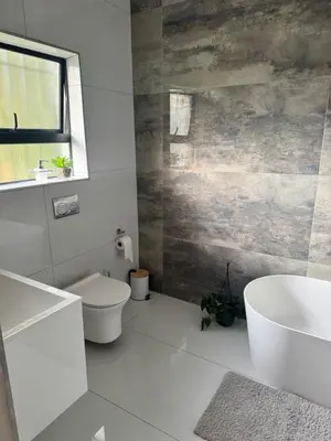 a bathroom with a toilet and a sink at Attorneys Place in Pretoria