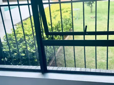 an open window with a view of a yard at Attorneys Place in Pretoria