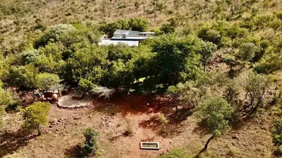 an aerial view of a house in the middle of trees at Zwartkloof 111 in Warmbaths