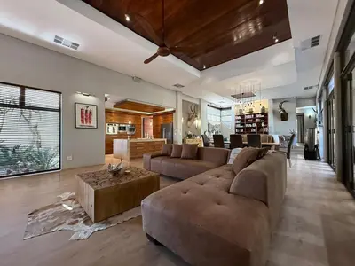 a large living room with a couch and a table at Zwartkloof 111 in Warmbaths