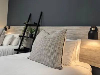 a bed with a pillow sitting on top of it at 34 Saligna st - 6 Guests Self Catering in Polokwane