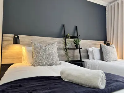 a bedroom with two beds with pillows on them at 34 Saligna st - 6 Guests Self Catering in Polokwane
