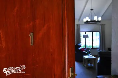 a wooden door in a living room with a living room at Lakeside 1 in Dullstroom