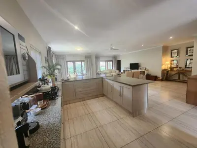 a large room with a kitchen and a living room at Maclarty House - Golf Estate Villa in White River