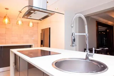a kitchen with a sink and a faucet at The Luthe in Thohoyandou