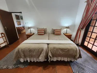 a bedroom with a large bed with pillows on it at Golf Estate Vacation Property - Poseidon's Knoll in White River