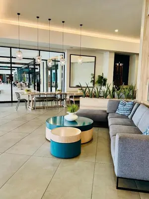 a living room with a couch and a table at 126Theblyde in Pretoria