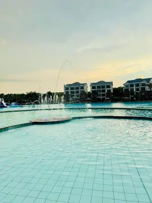 a fountain in the middle of a pool at 126Theblyde in Pretoria