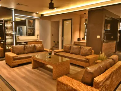 a living room with couches and a coffee table at Gweda Lodge in Ouklip