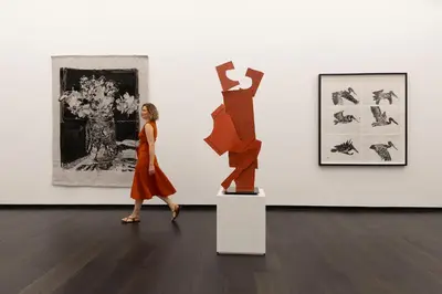 a woman walking past a sculpture in an art exhibit at Cheetah Plains Private Game Reserve in Sabi Sand Game Reserve