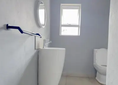 a bathroom with a sink and a toilet at Amoris Guesthouse - Hillcrest Brooklyn in Pretoria
