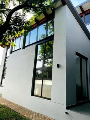 a building with windows on the side of it at The Cottage in Secured Estate in Pretoria