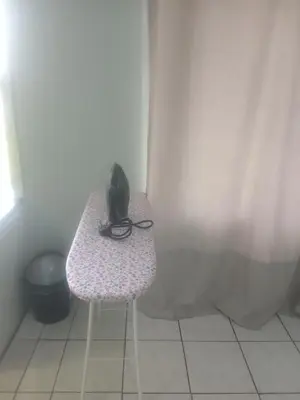 a telephone sitting on a bench in a bathroom at Inspire living home in Kempton Park