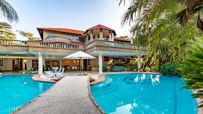 an image of a villa with a swimming pool at Villa Christies at 32 on Russell in Nelspruit