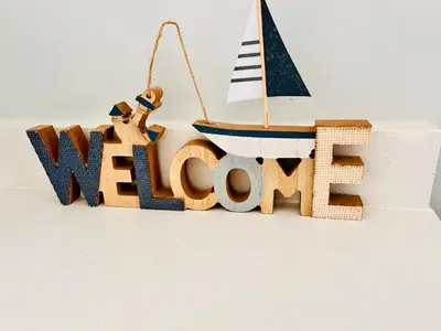 a wooden welcome sign with a sailboat on it at Stunning 1 bed in Midrand at 93 On New Estate in Midrand