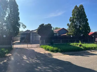 a fence in front of a row of houses at AS contractors accommodation in Erasmus