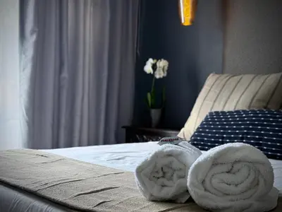 a pair of towels sitting on top of a bed at Olive Branch in Bethal