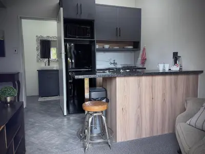 a kitchen with a counter and a stove top oven at Olive Branch in Bethal