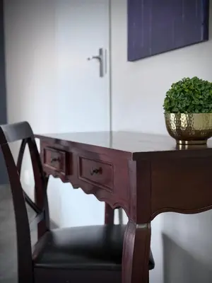 a wooden table with a plant on top of it at Olive Branch in Bethal