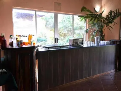 a kitchen with a bar with a counter top at Bonamanzi Guesthouse in Burgersfort