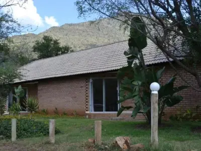 a brick house with a plant in front of it at Bonamanzi Guesthouse in Burgersfort