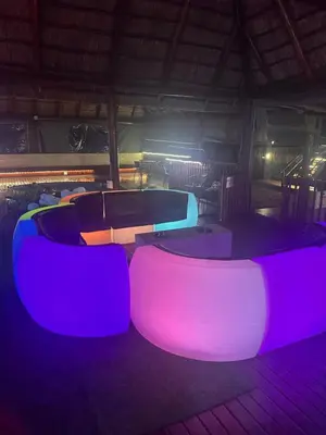 a room with purple and pink tables and chairs at Falcon Lodge PK in Bela-Bela