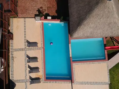 an overhead view of a building with a blue door at Falcon Lodge Bela in Bela-Bela