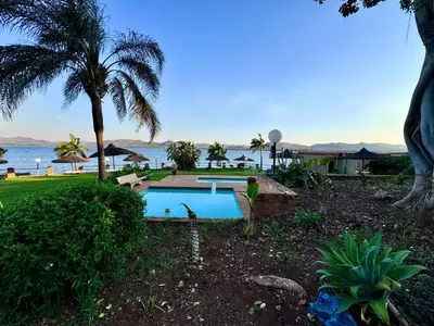 a swimming pool with a view of the ocean at Olives by Agnes 33 in Hartbeespoort