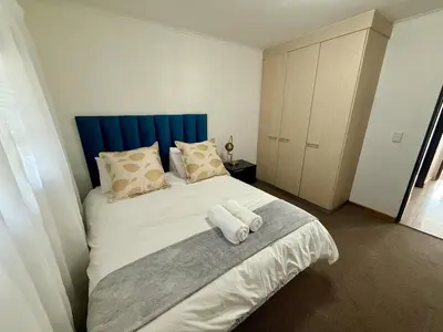 a bedroom with a bed with two towels on it at Lynwood 919 in Pretoria