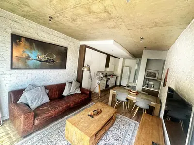 a living room with a couch and a table at Menlo Gate in Pretoria