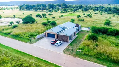 an overhead view of a house with a car parked in front at Batau Villa in Naboomspruit