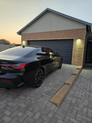 a car parked in front of a garage at Batau Villa in Naboomspruit