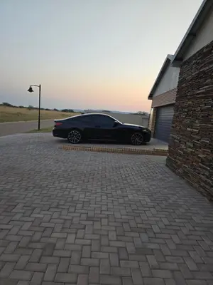 a black car parked next to a building at Batau Villa in Naboomspruit