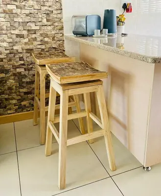 a kitchen with two stools and a counter top at Phoenix Rising Apartment in Midrand