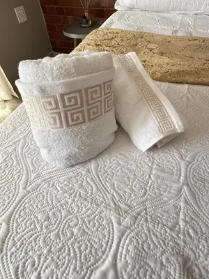 a white bed with two pillows on top of it at Home Away Nest in Witbank