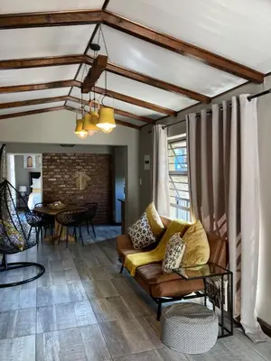 a living room with a couch and a table at Stayfit 01 in Polokwane