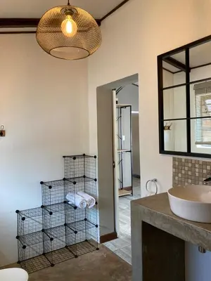 a bathroom with a sink and a cage at Stayfit 01 in Polokwane