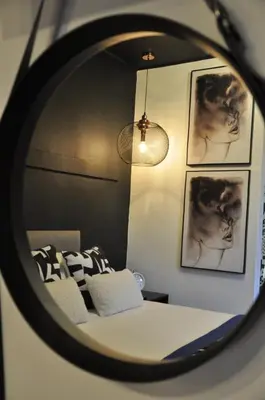 a reflection of a bedroom with a bed in a mirror at StayFit 02 in Polokwane