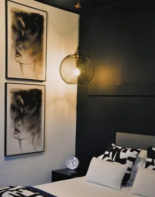 a bedroom with a bed and pictures on the wall at StayFit 02 in Polokwane