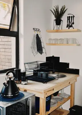 a kitchen with a table with a tea kettle on it at StayFit 02 in Polokwane